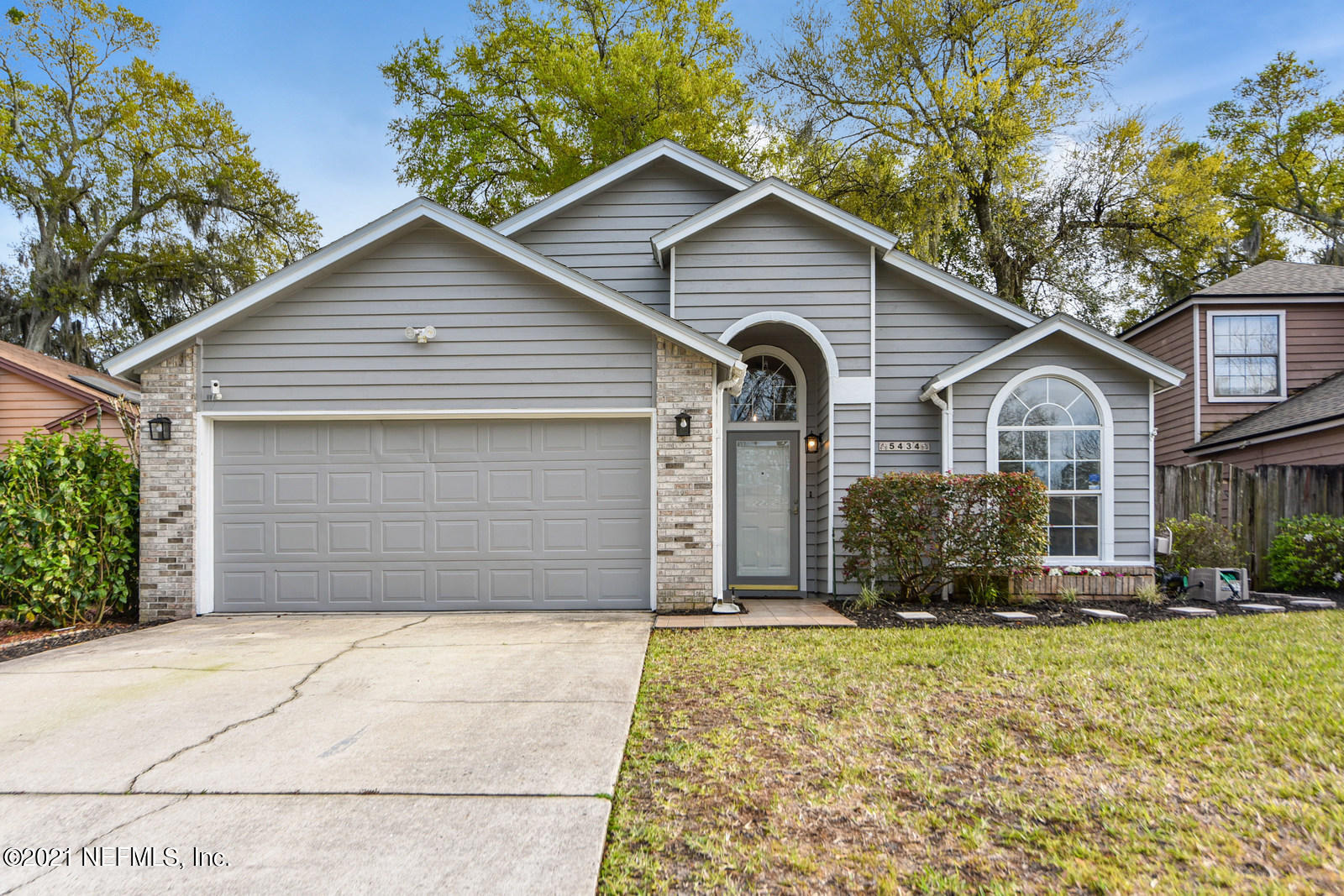 5434 Fort Caroline Road Jacksonville, FL 32277 - Photo 2 of 26 a front view of a house with a yard