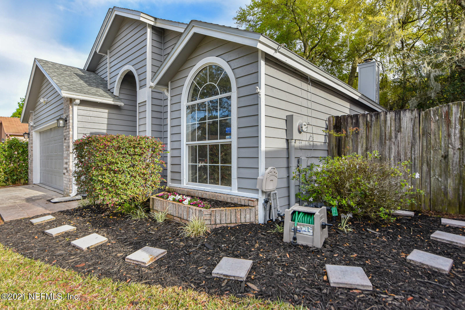 5434 Fort Caroline Road Jacksonville, FL 32277 - Photo 4 of 26 a front view of a house with garden