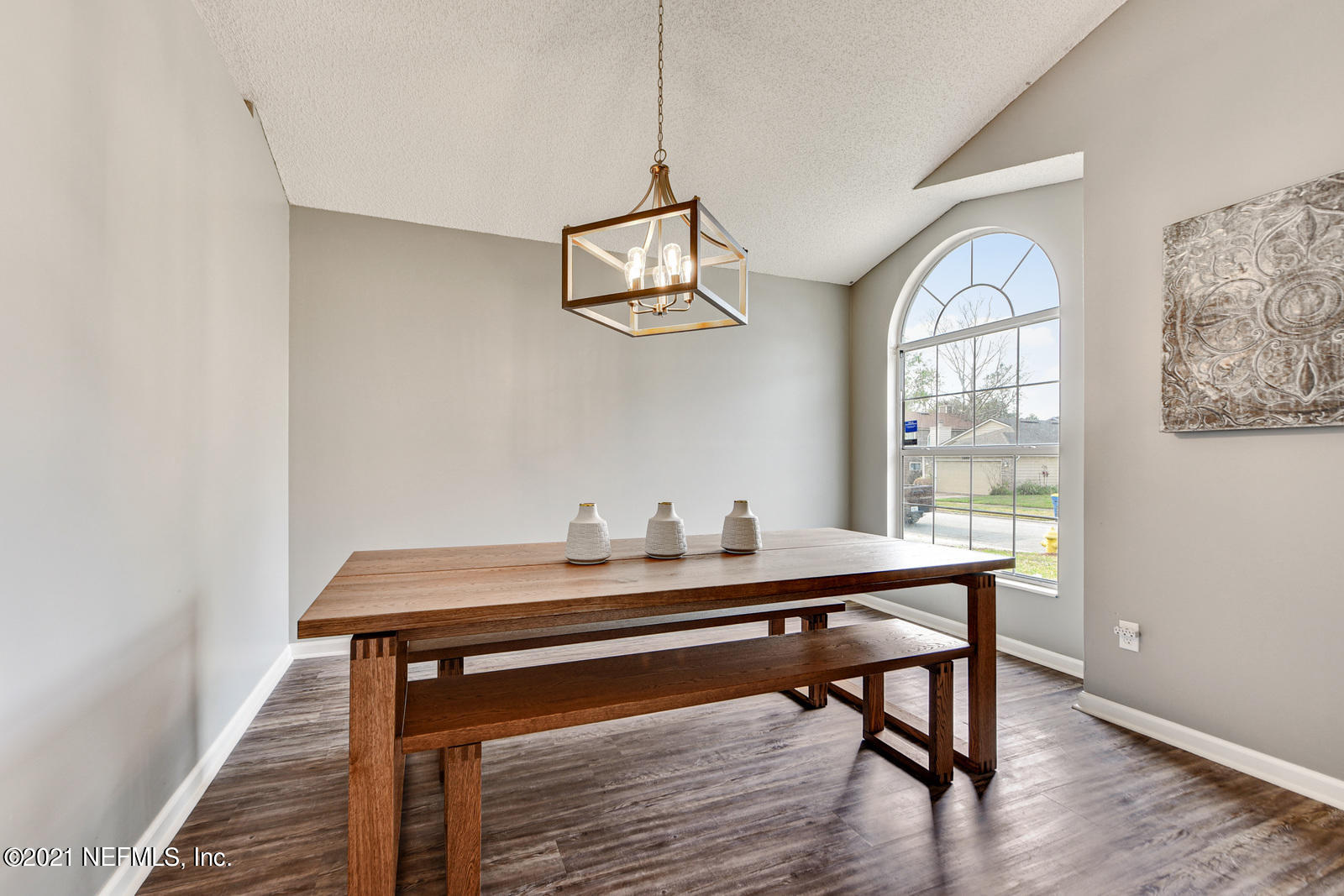 5434 Fort Caroline Road Jacksonville, FL 32277 - Photo 6 of 26 a room with a table a window and wooden floor