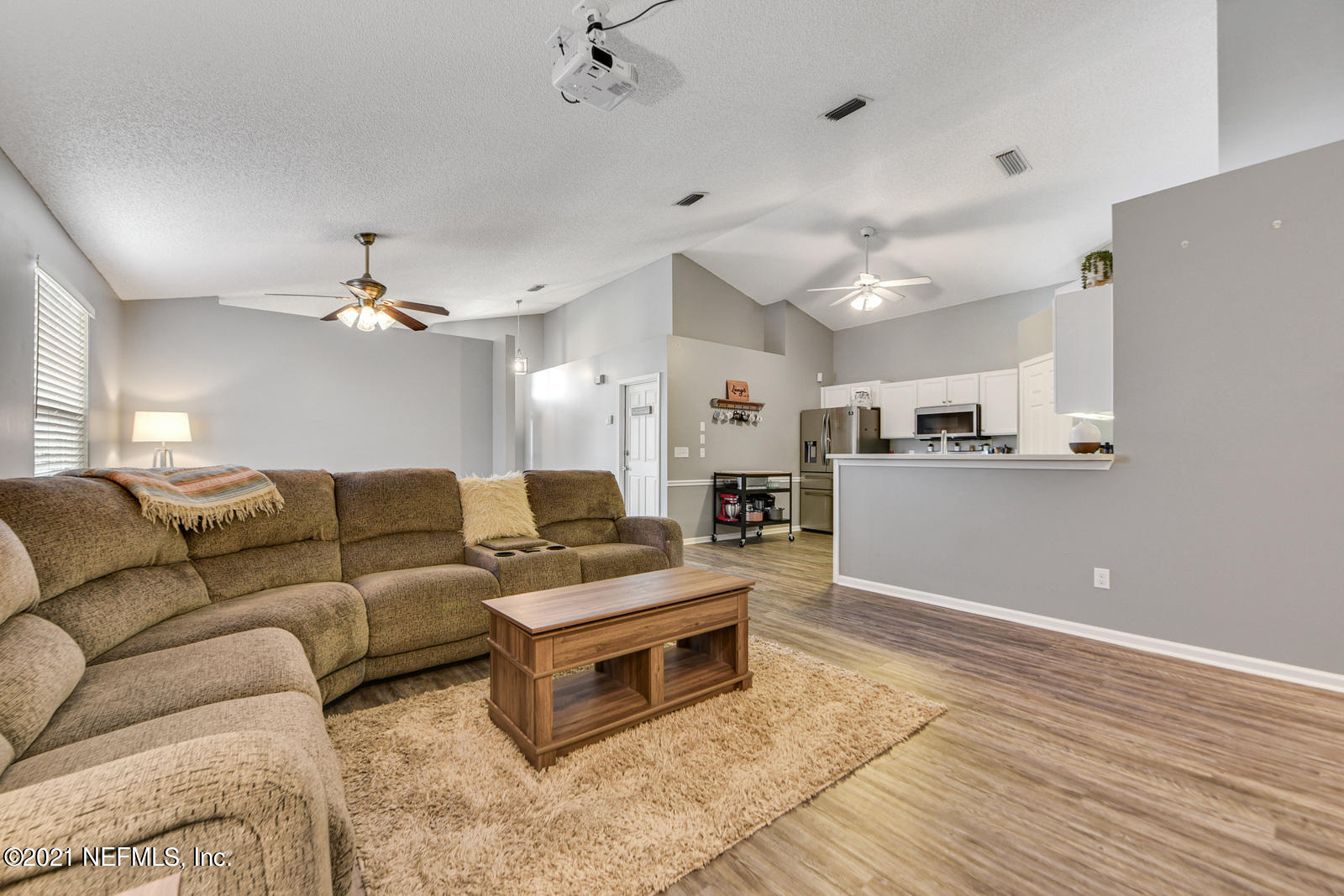 5434 Fort Caroline Road Jacksonville, FL 32277 - Photo 9 of 26 a living room with furniture and kitchen view