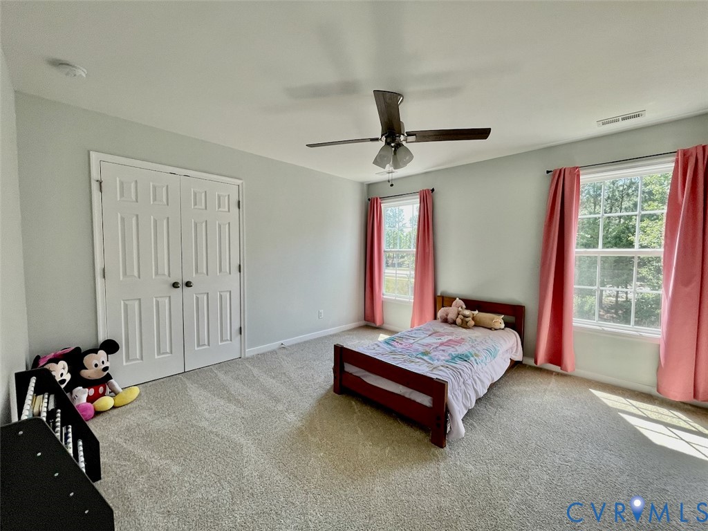9506 Simonsville Road Midlothian, VA 23112 - Photo 19 of 27 a bedroom with a bed and a window