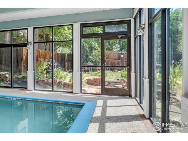 a living room with furniture a wooden floor and a fireplace