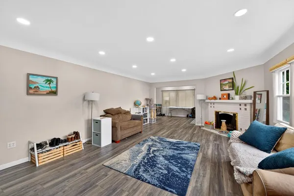 a living room with furniture or couch and a large window