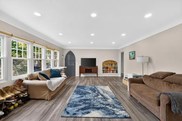 a view of a living room and hardwood floor