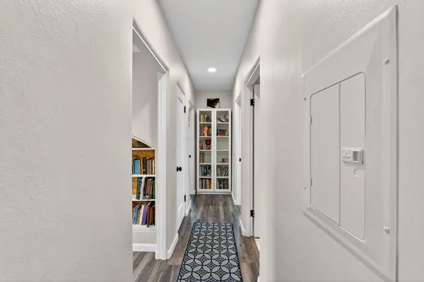 a bedroom with a bed and a desk