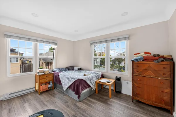 a bed room with a bed and a window