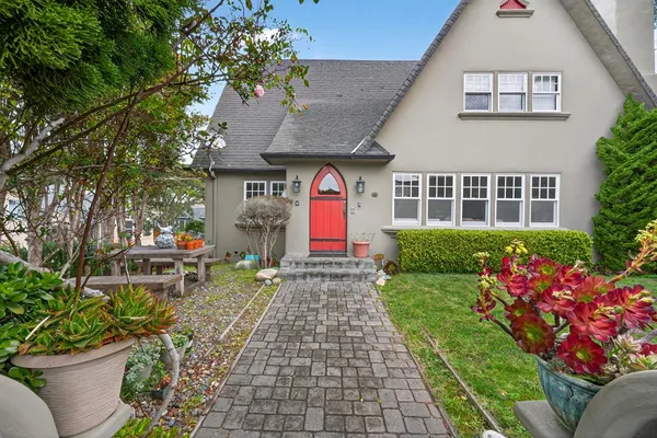 a front view of a house with a yard