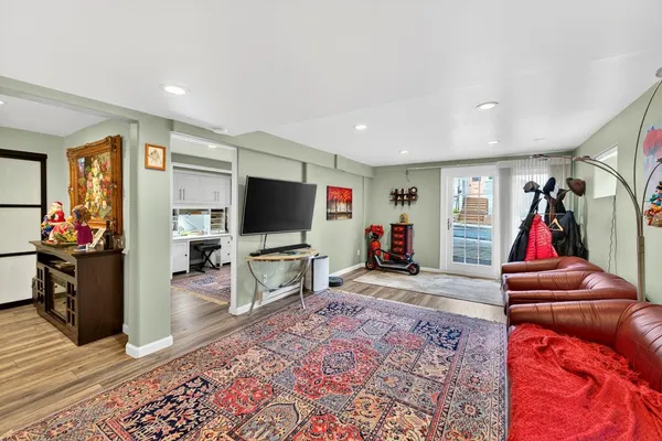 a kitchen with stainless steel appliances granite countertop a refrigerator stove a sink and a microwave