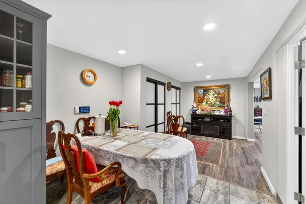a bathroom with a double vanity sink mirror and shower