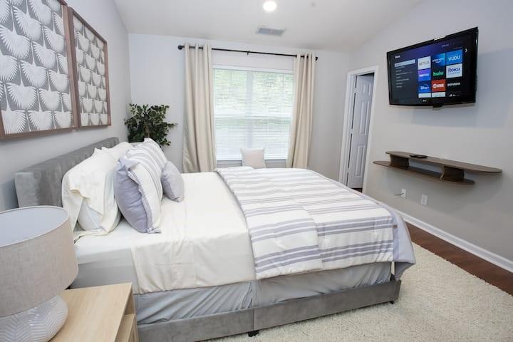 743 Crestwell Circle Atlanta, GA 30331 - Photo 11 of 20 a bedroom with a bed and a flat screen tv