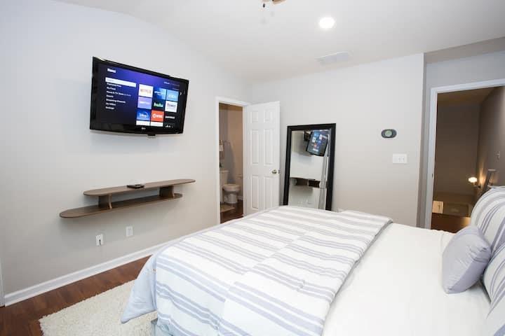743 Crestwell Circle Atlanta, GA 30331 - Photo 12 of 20 a bedroom with a bed and a flat screen tv