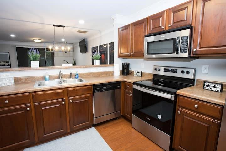 743 Crestwell Circle Atlanta, GA 30331 - Photo 7 of 20 a kitchen with stainless steel appliances granite countertop a stove a sink and a microwave
