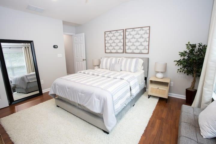 743 Crestwell Circle Atlanta, GA 30331 - Photo 10 of 20 a bed room with a bed lamp and a potted plant