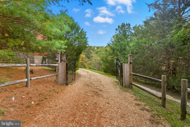 a view of a patio with table and chairs