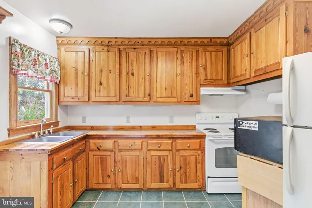 a balcony with a table and chairs