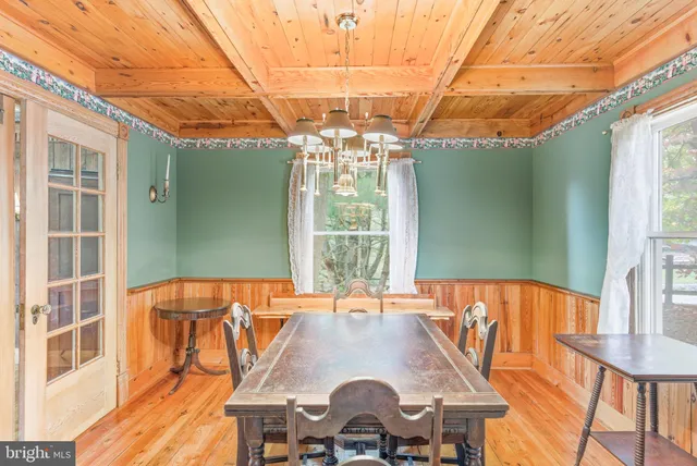 a view of balcony with furniture and garden