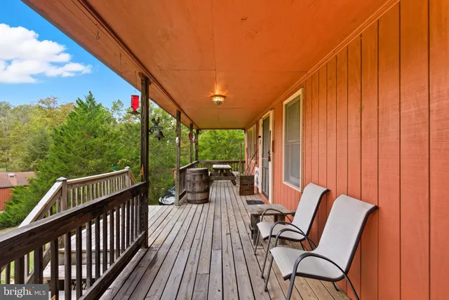 a living room with furniture a window and a fireplace
