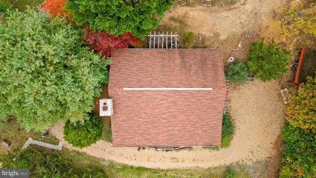 a living room with furniture a window and a fireplace
