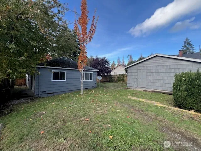a view of backyard and entertaining space
