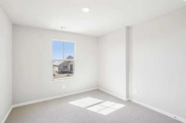 an empty room with closet area