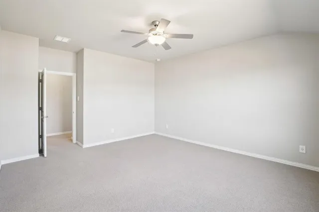 a bathroom with a shower sink and mirror