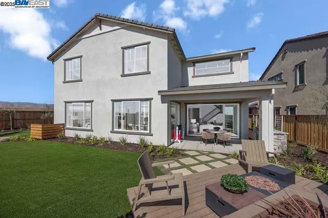 a view of a house with backyard porch and patio