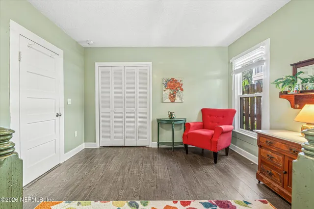a view of a house with a yard and sitting area