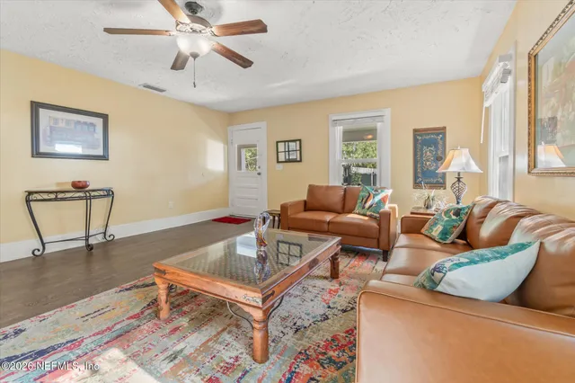 a living room with furniture and a table