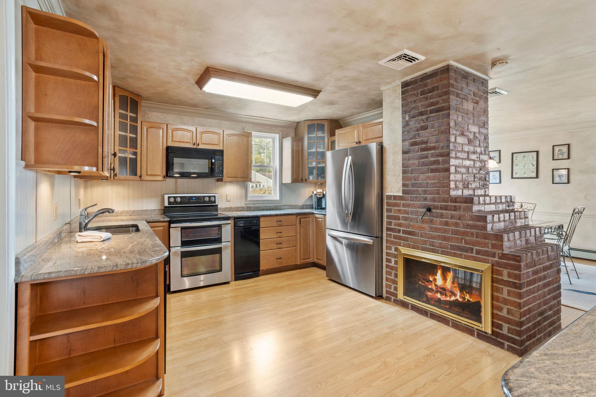 74 Gaping Rock Road Levittown, PA 19057 - Photo 12 of 31 a kitchen with stainless steel appliances a stove microwave and refrigerator
