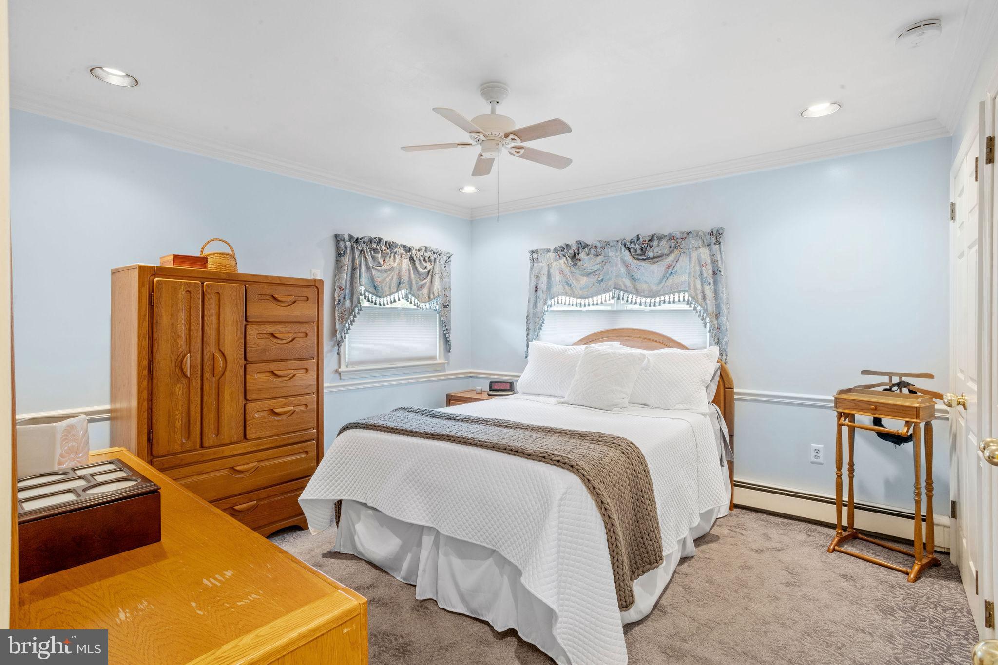 74 Gaping Rock Road Levittown, PA 19057 - Photo 13 of 31 a bedroom with a bed and wooden floor