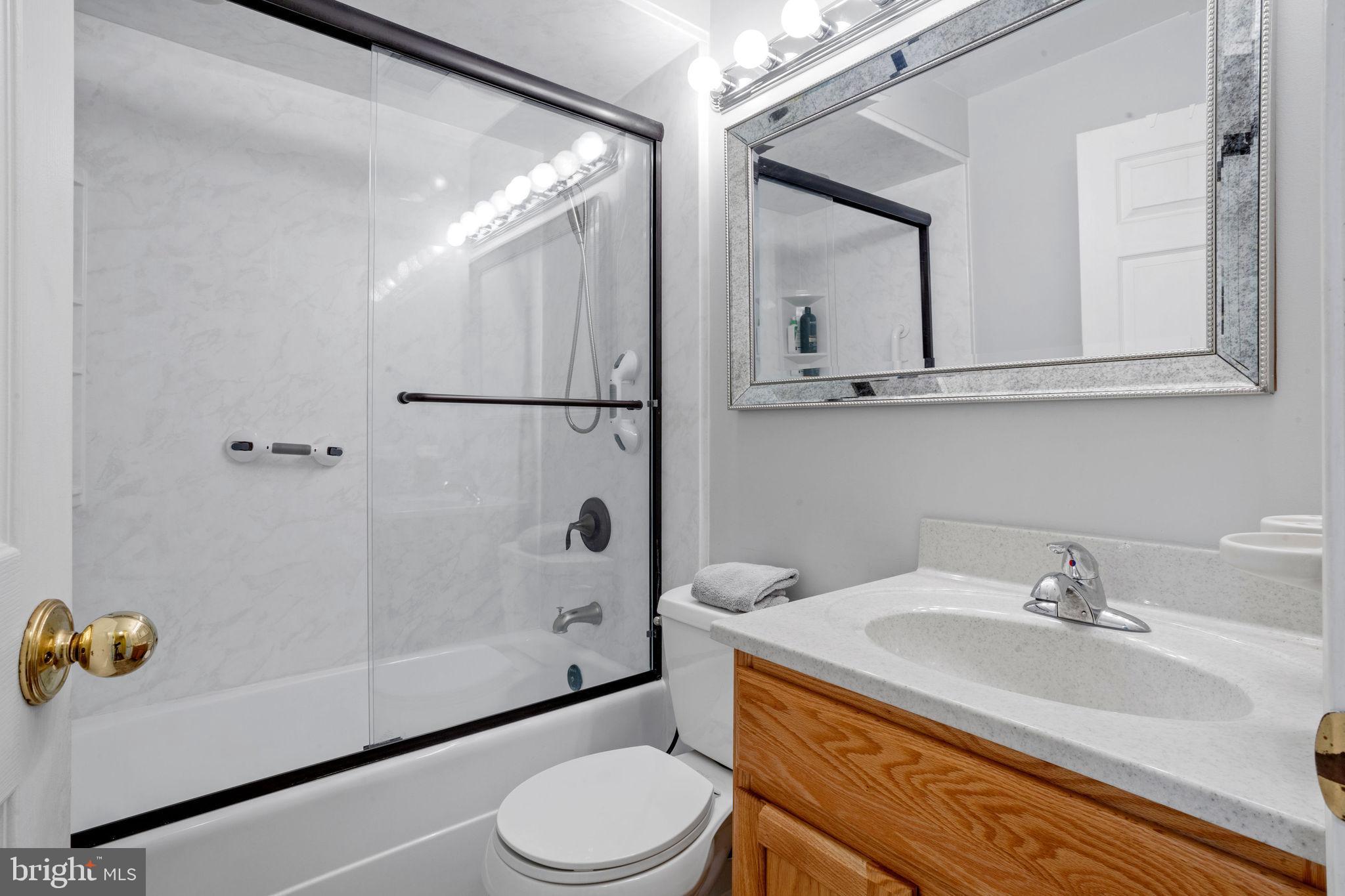 74 Gaping Rock Road Levittown, PA 19057 - Photo 15 of 31 a bathroom with a sink toilet and shower