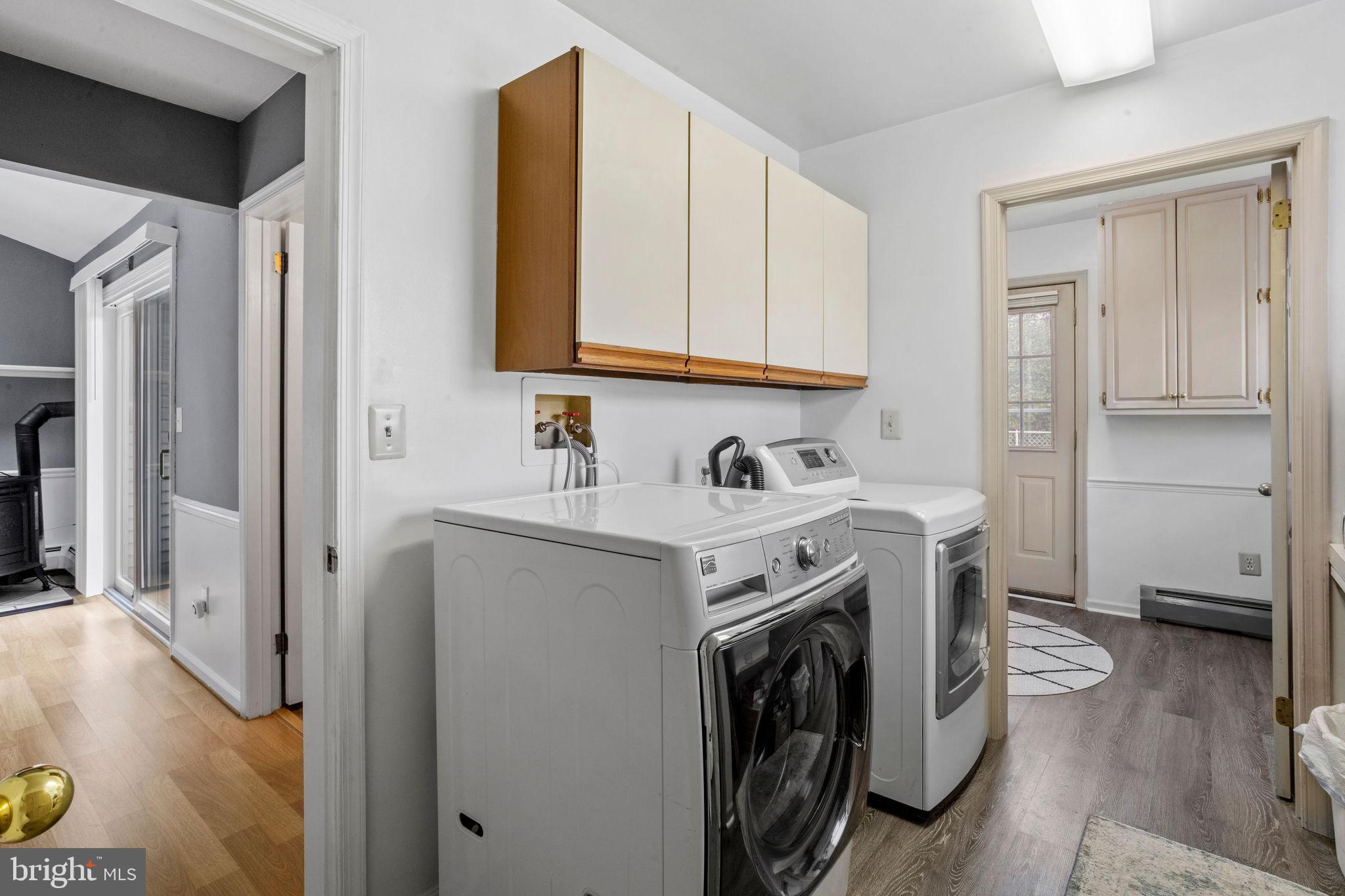 74 Gaping Rock Road Levittown, PA 19057 - Photo 20 of 31 a utility room with cabinets washer and dryer