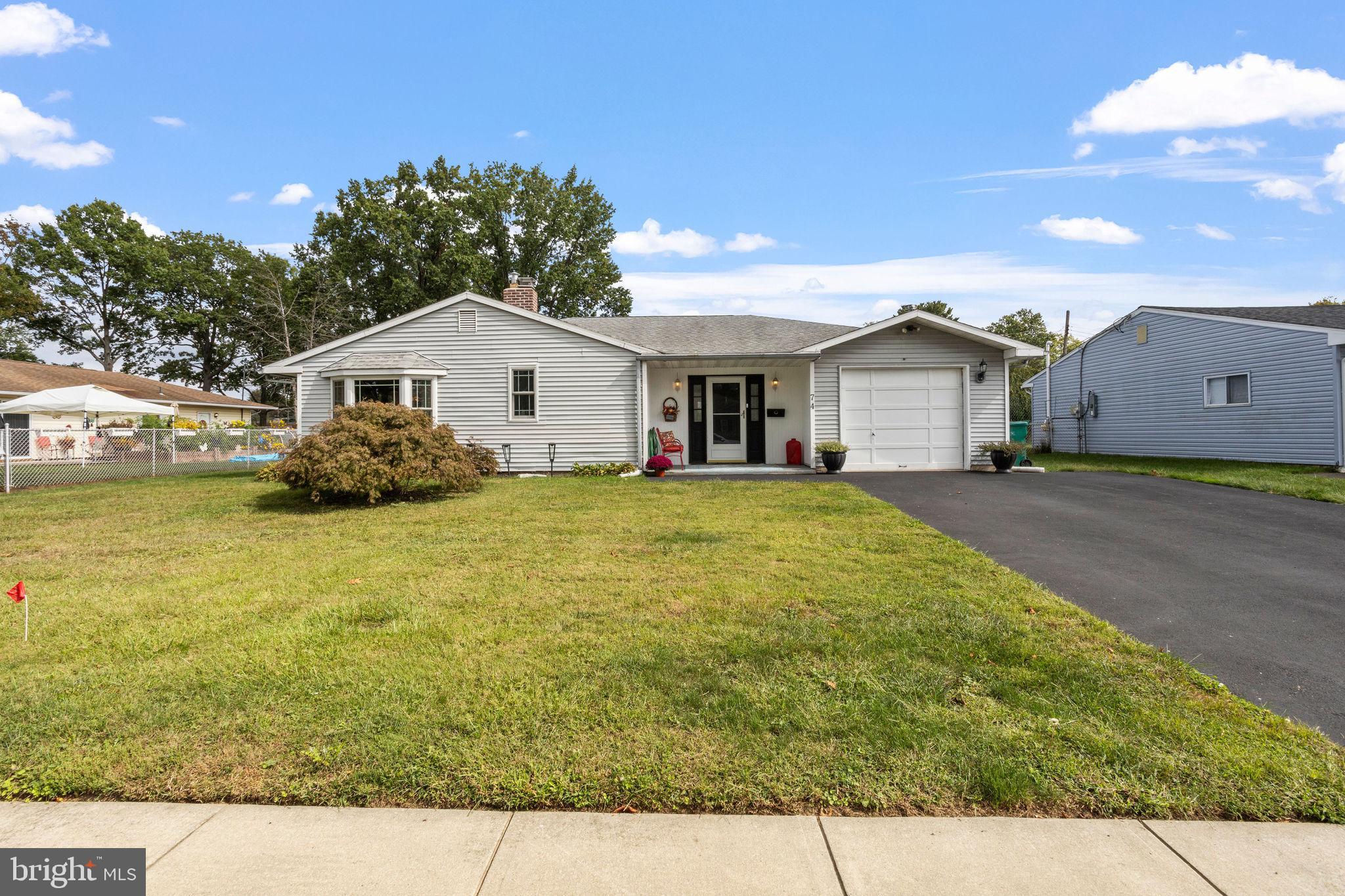 74 Gaping Rock Road Levittown, PA 19057 - Photo 29 of 31 a view of a house with a yard
