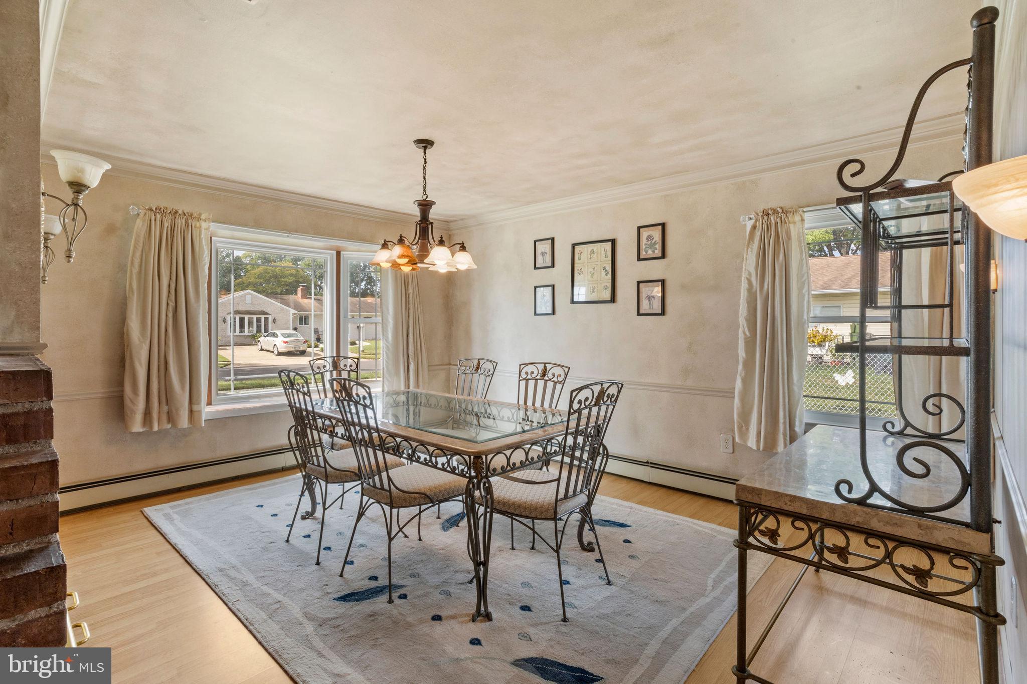 74 Gaping Rock Road Levittown, PA 19057 - Photo 8 of 31 a view of a dining room with furniture window and wooden floor