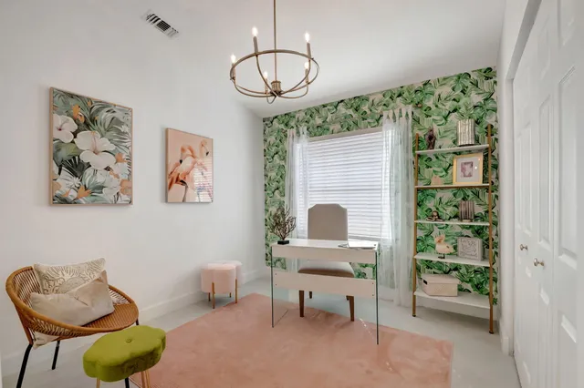 a work room with furniture and a window