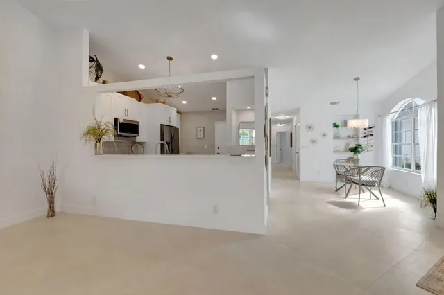 a view of a building with a table and chairs