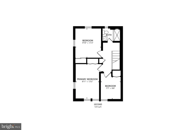 a picture of a bench in front of a wall