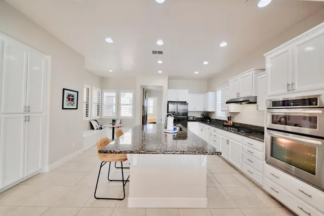 a bathroom with a sink toilet tub and shower