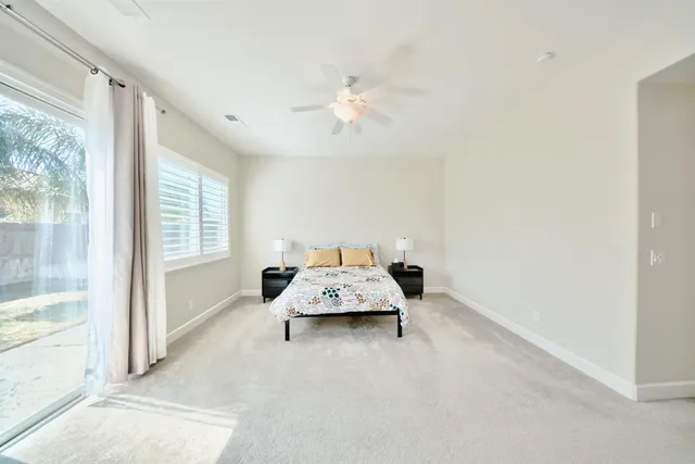 a bedroom with a bed and a couch