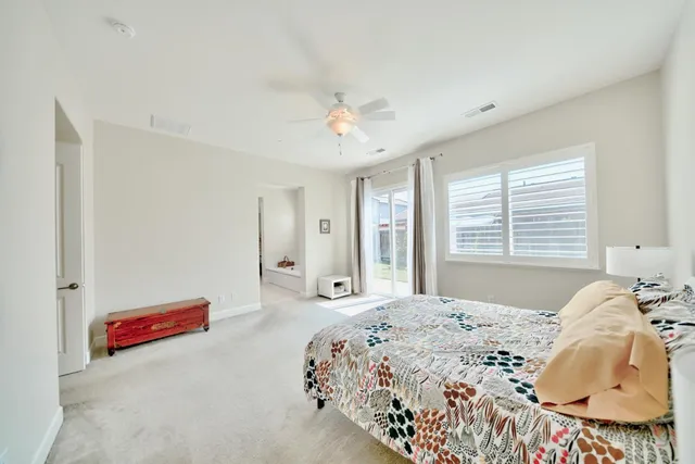a view of a patio with table and chairs and potted plants