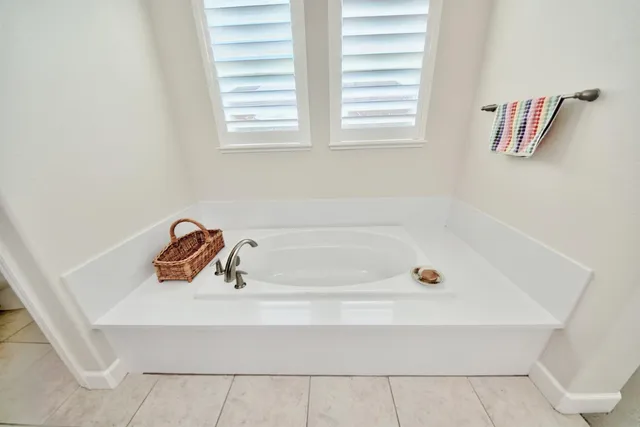 a view of a patio with couches table and chairs and potted plants