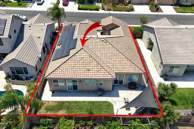 a kitchen with stainless steel appliances granite countertop a stove a sink a microwave and a refrigerator