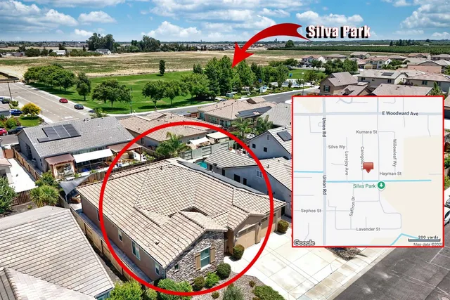 a kitchen with granite countertop cabinets and white appliances