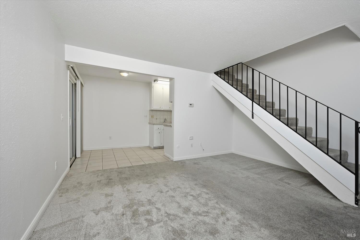 1213 Fair Oaks Avenue Santa Rosa, CA 95404 - Photo 2 of 27 a view of an empty room with stairs