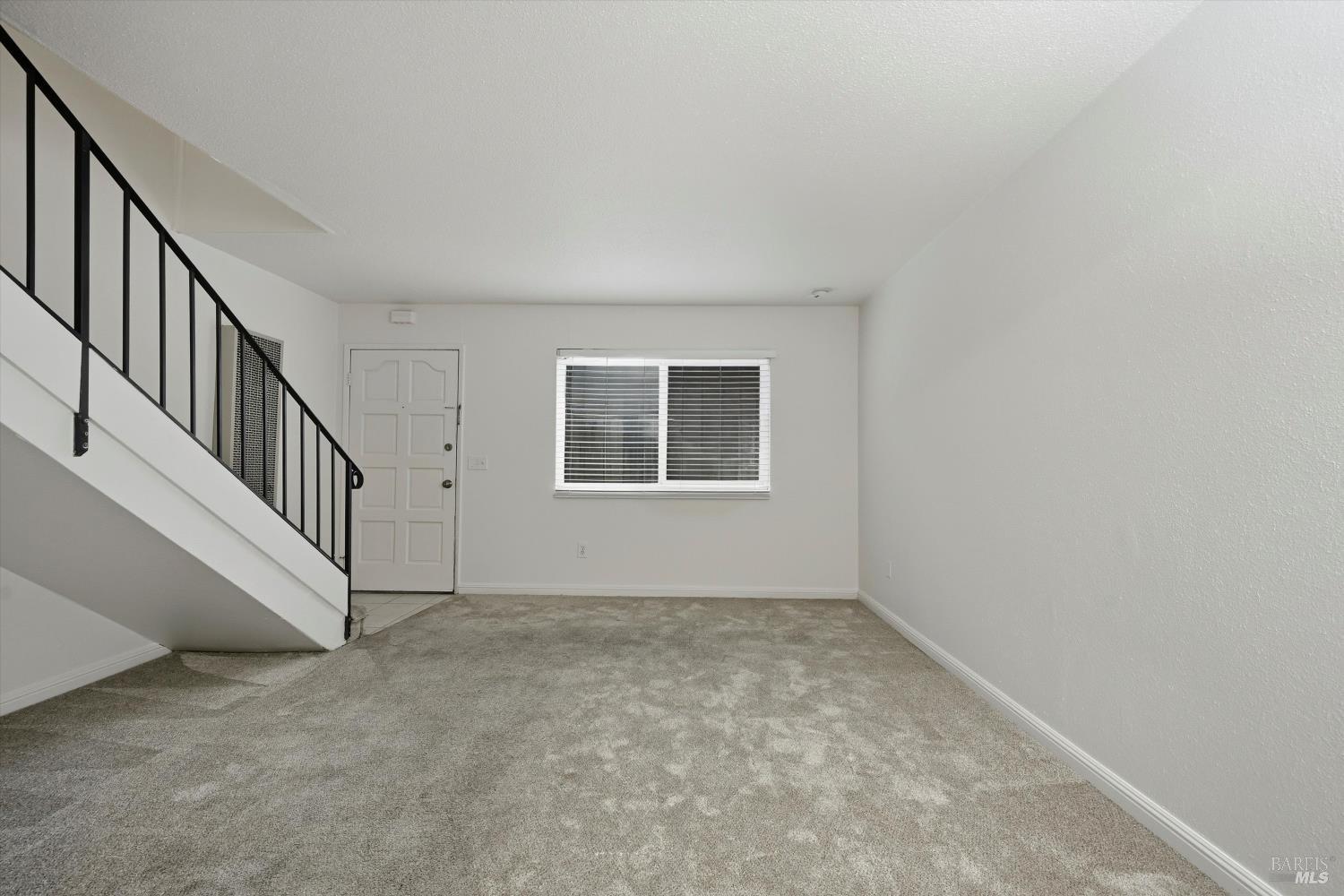 1213 Fair Oaks Avenue Santa Rosa, CA 95404 - Photo 4 of 27 a view of an empty room with stairs