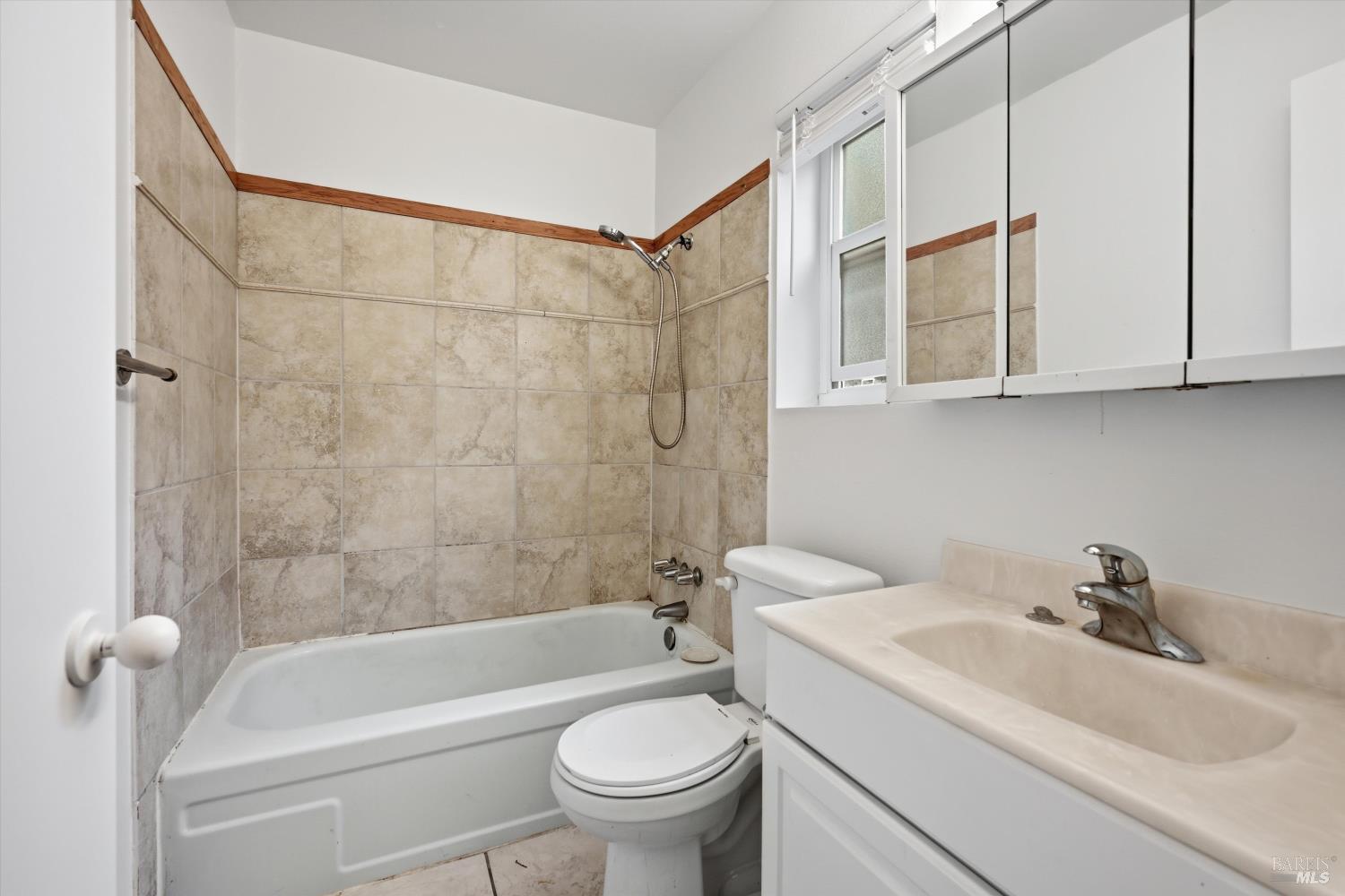 1213 Fair Oaks Avenue Santa Rosa, CA 95404 - Photo 8 of 27 a bathroom with a sink a toilet and shower