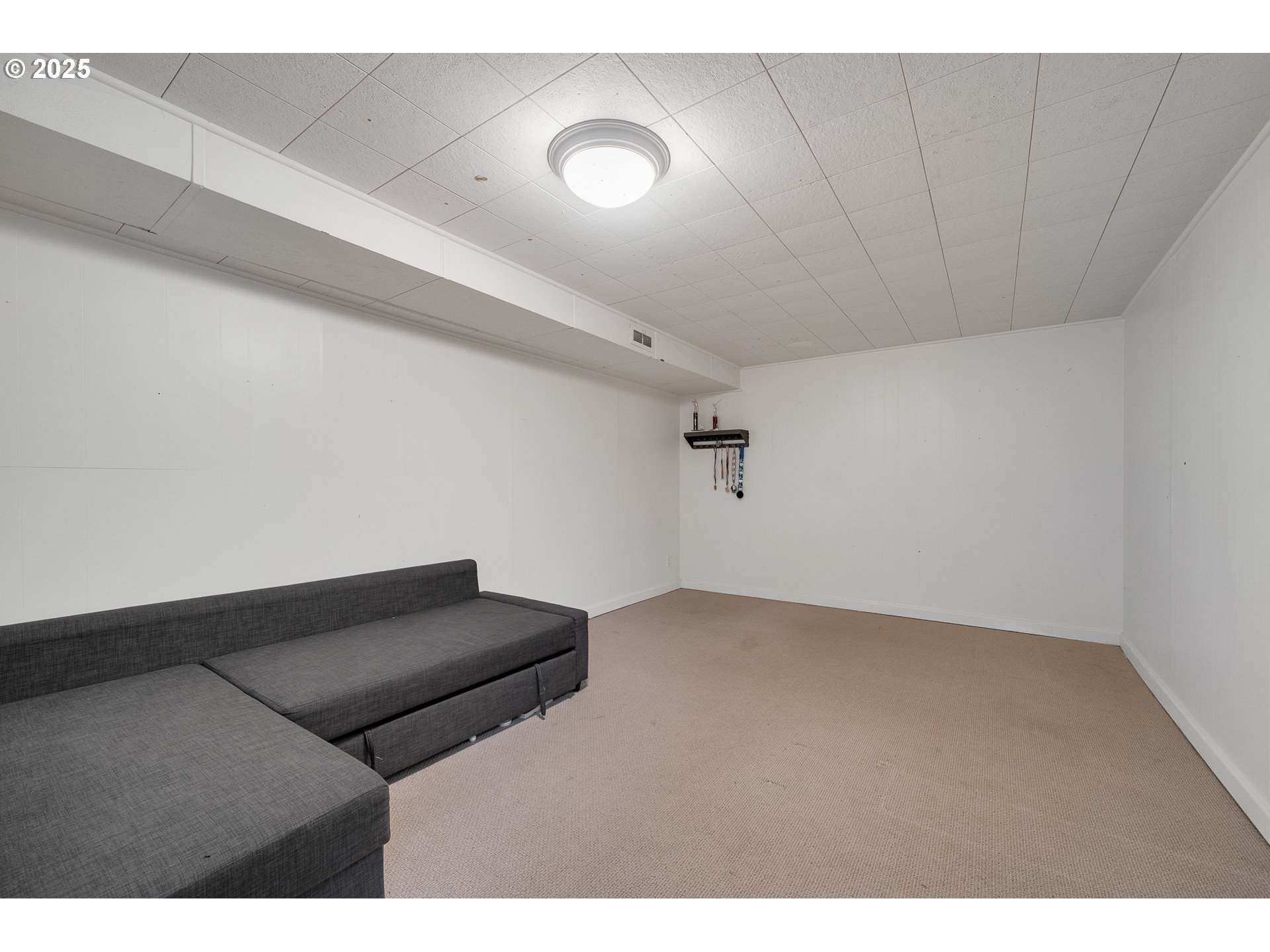 33281 Kammeyer Road Scappoose, OR 97056 - Photo 24 of 48 a living room with a couch and a projector screen