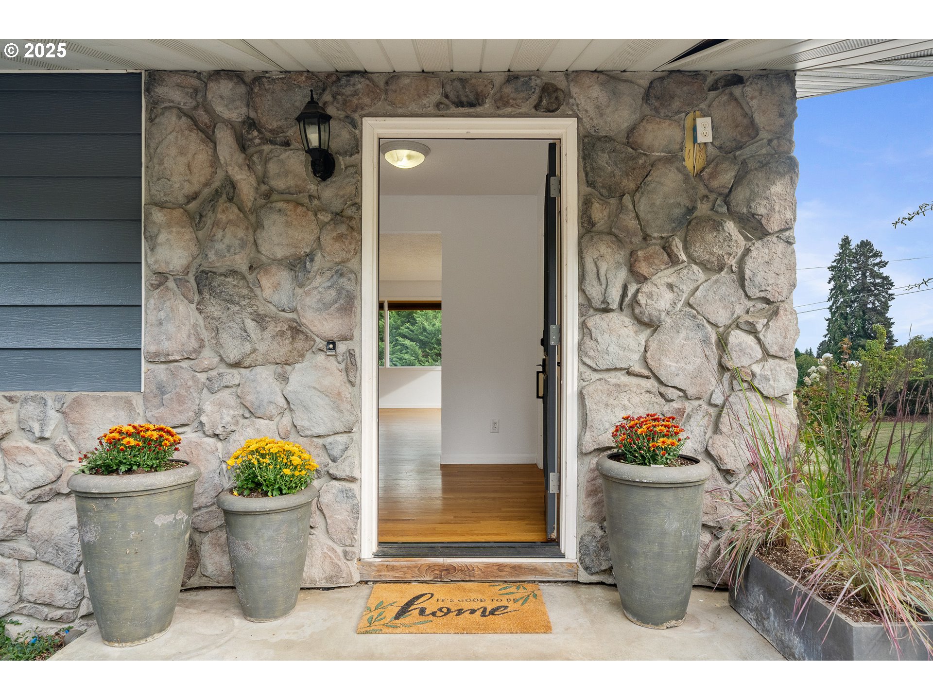 33281 Kammeyer Road Scappoose, OR 97056 - Photo 5 of 48 a view of a fruit potted plant and tree in front of a door