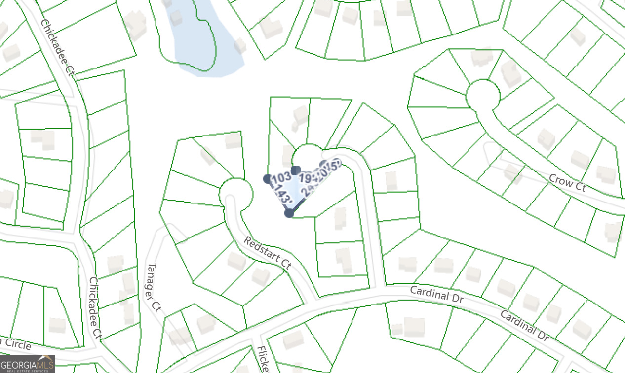 0 Redstart Court Monticello, GA 31064 - Photo 2 of 3 wooden floor with a white comforter and a painting on the wall