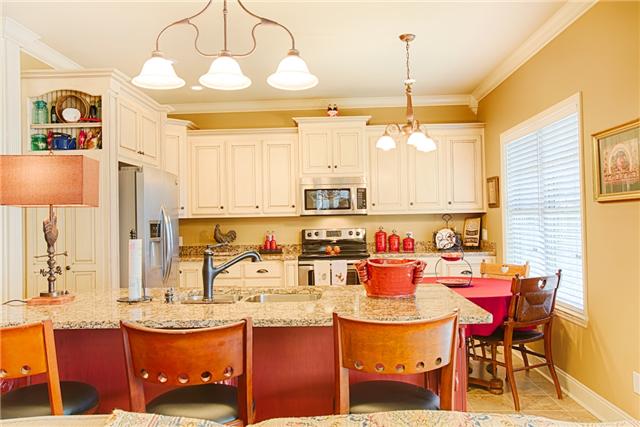 17215 Lakeside Estates Road Athens, AL 35614 - Photo 8 of 20 a kitchen with a dining table and chairs